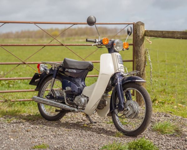 Win this 1999 Honda C70 DX Super Cub + £250